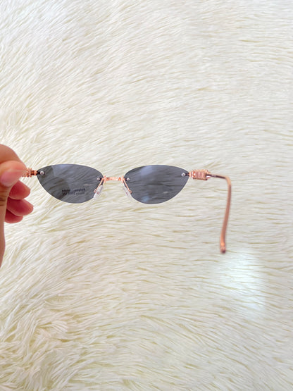 Lentes montura metálica color rosado/dorado estilo cat-eye.