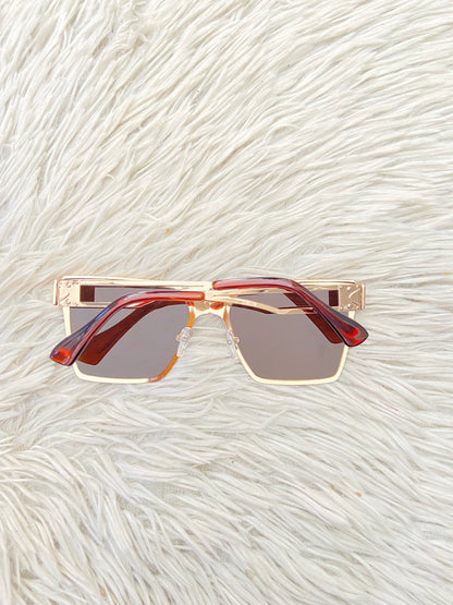 Lentes, diseñados con protección UV 100-400 para proteger tu visión. Marrón con montura en dorado y micas marrones.