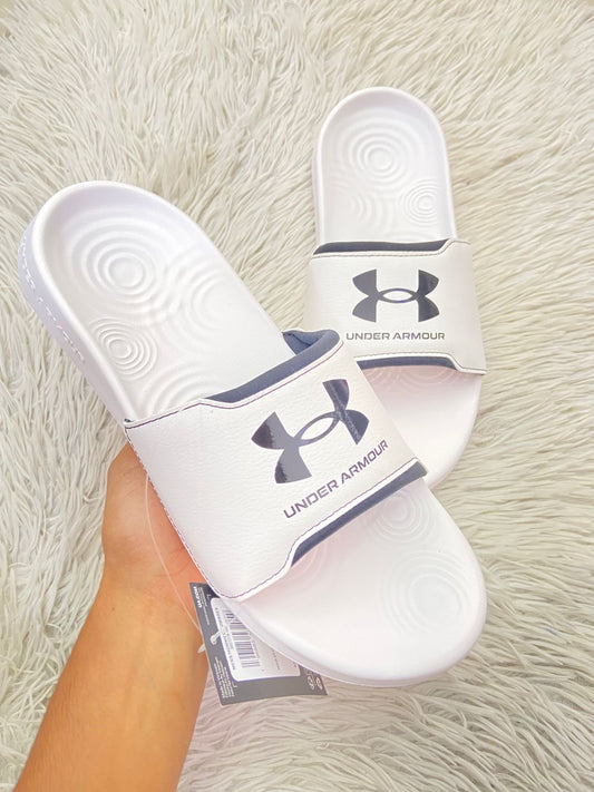 Sandalias UNDER ARMOUR Original, en color blanco con letra y logotipo de la marca en color negro al frente.