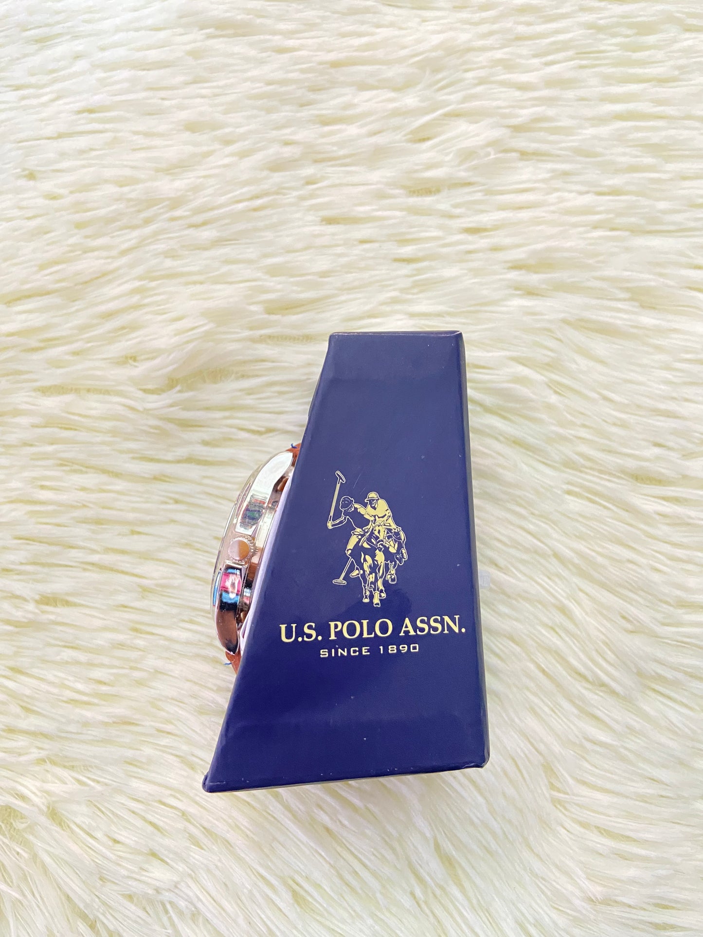 Reloj U.S POLO original, marron con costura en hilo azul, y fondo azul con plateado.