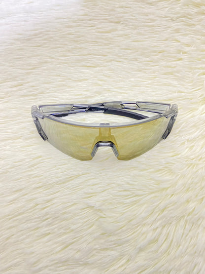 Lentes, gris con micas que cambian de color a dorado cromados, 100 % Polycarbonate más protección UV.