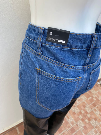 Pantalón Jean azul marino oscuro, mitad en leader.