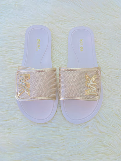 Sandalias MICHAEL KORS original, dorado con blanco y letras MK al lado.