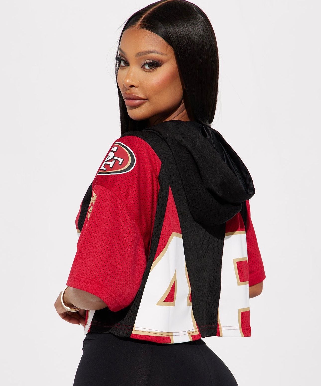 Top NFL original, negro con rojo, blanco y letras SF en blanco, y capucha.