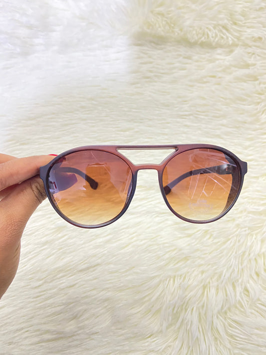 Lentes, marron con micas claras redondos y protecciones UV 400.