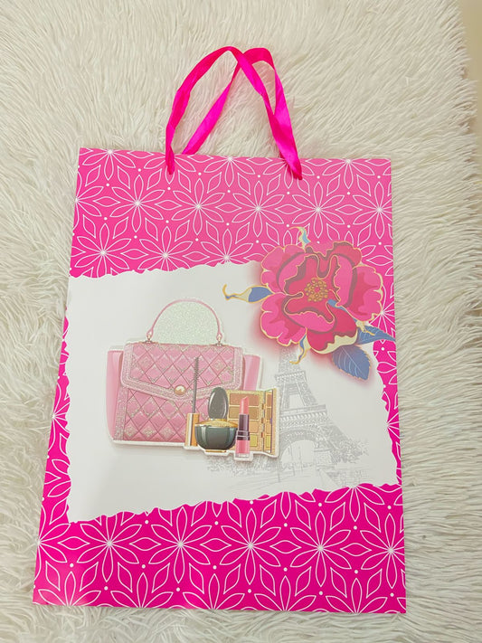 Shopping Rosado con blanco y estampado de rosas y cartera con maquillaje.