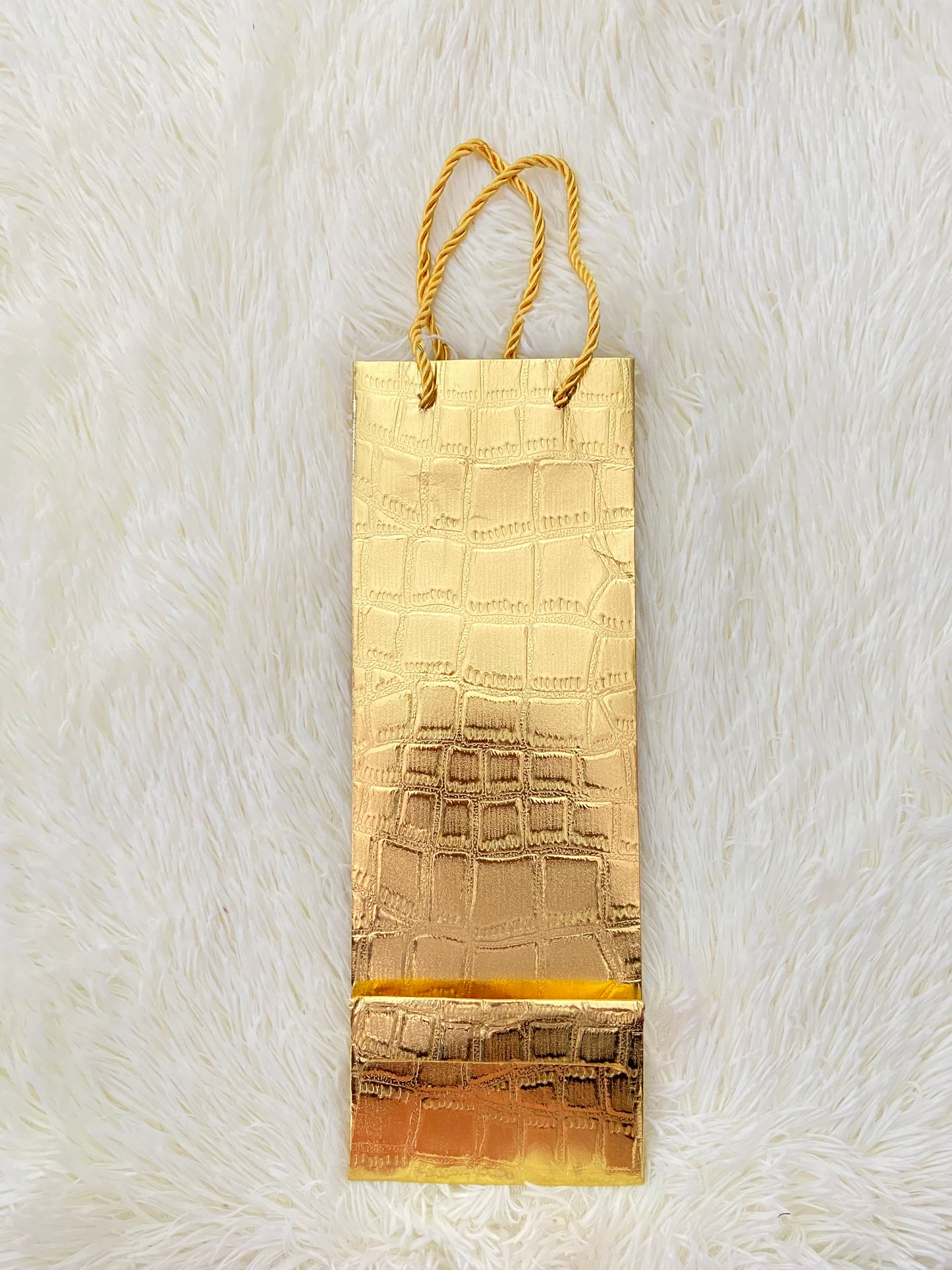 Shopping, dorado con lazos del mismo color.