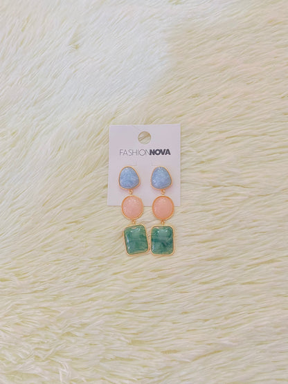 Aretes de tres piezas en color azul, rosado claro y verde.