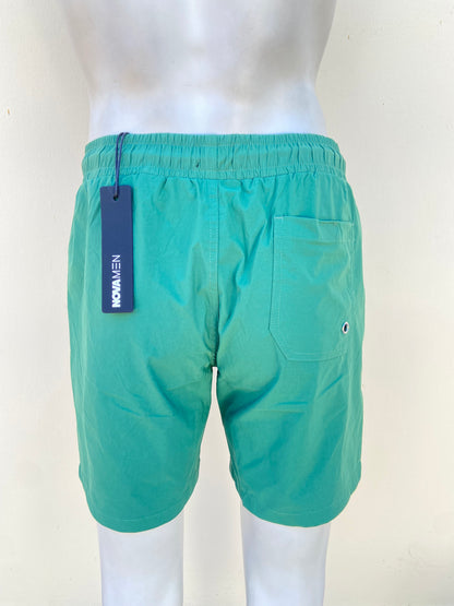 Bañador/Baggy, verde oscuro liso, con lazos ajustables.