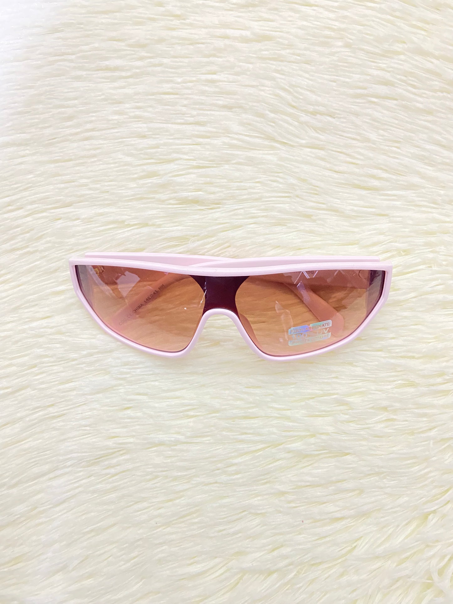 Lentes, rosado claros con micas en color marron y detalles en plateado, 100 % Polycarbonate y protección UV.