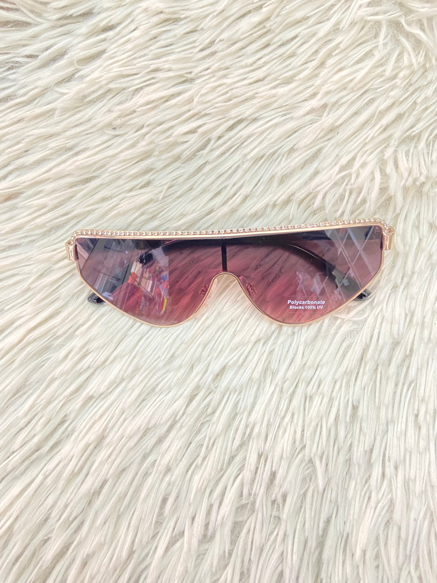 Lentes, negro con micas claras y detalles de brillos en la parte de arriba.