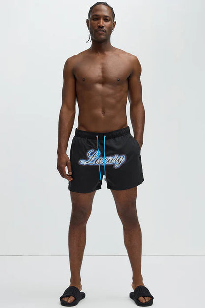 Bañador Baggy en color negro con letras azules LUXURY