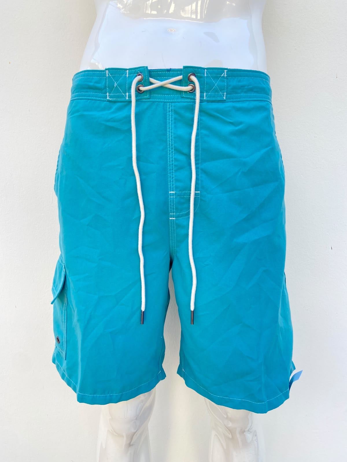Baggy/bañador, azul turquesa liso con lazos ajustables blancos Protección UPF 50+: Brinda protección contra los rayos UV.