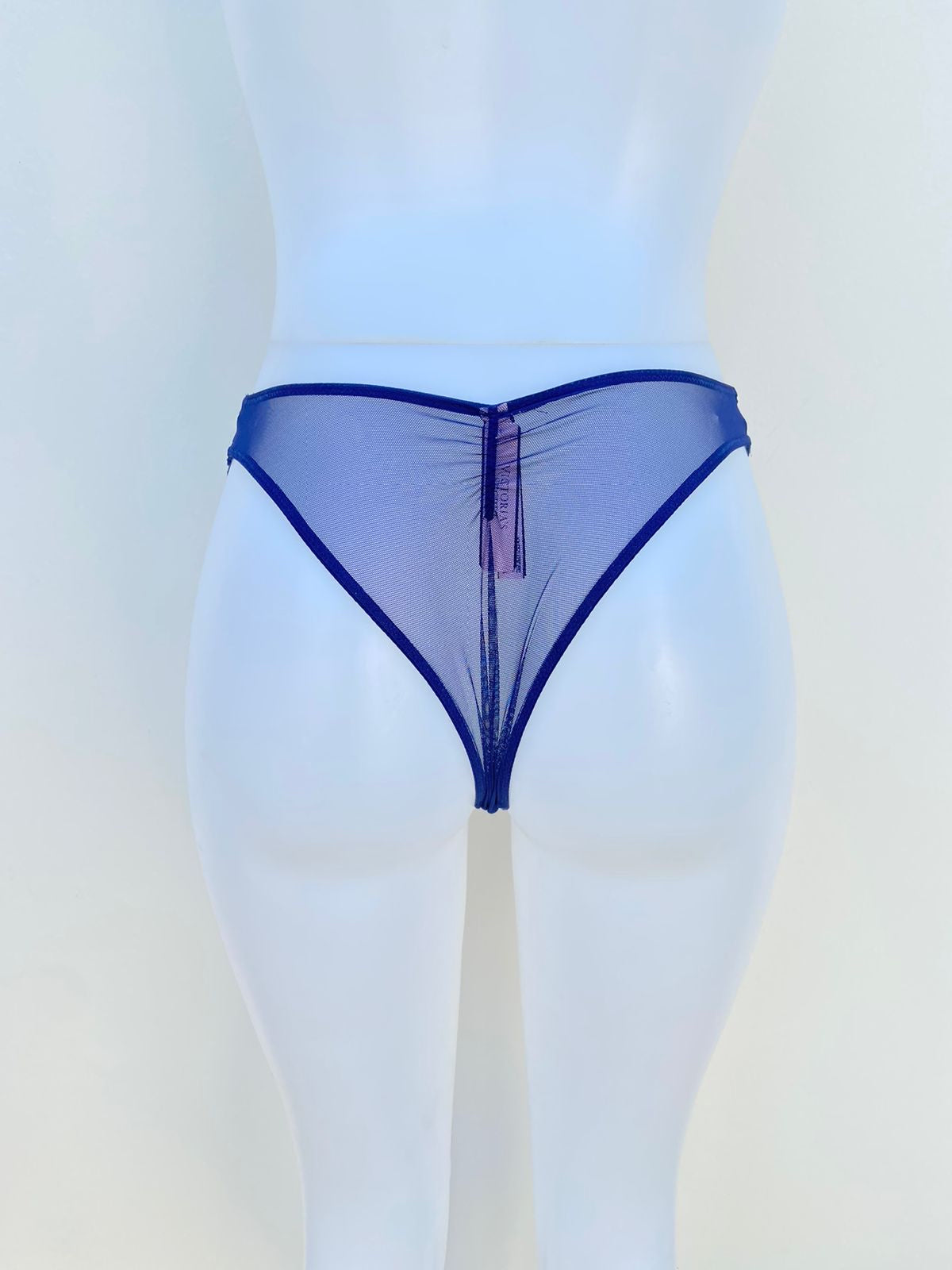 Panti Victoria’s Secret original, azul con descubiertos en el centro y transparente en la parte detrás.