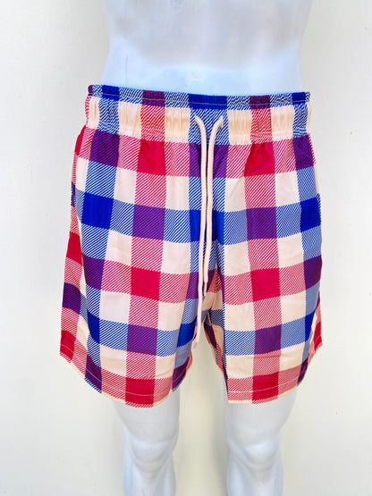 Bañador/ Baggy, crema con estampado de cuadros en color rojo y azul y lazos ajustables.