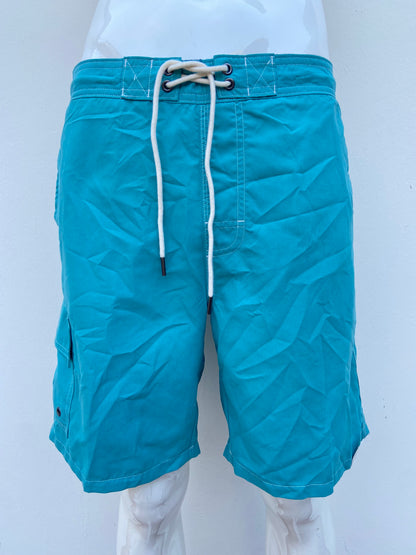 Baggy/bañador, azul turquesa liso con lazos ajustables blancos Protección UPF 50+: Brinda protección contra los rayos UV.