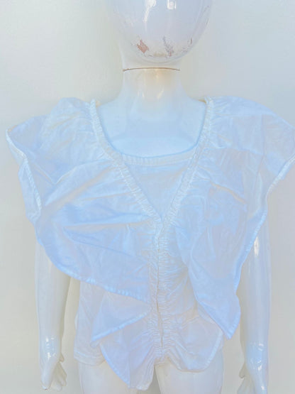 Blusa ZARA para niñas blanca con mangas con vuelo.