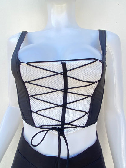 Top, negro con blanco estilo corset y lazos ajustables.