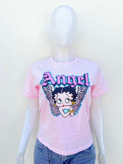 T-shirt FLEISCHER STUDIOS original rosado claro con estampado de una muñeca y letras ÁNGEL.