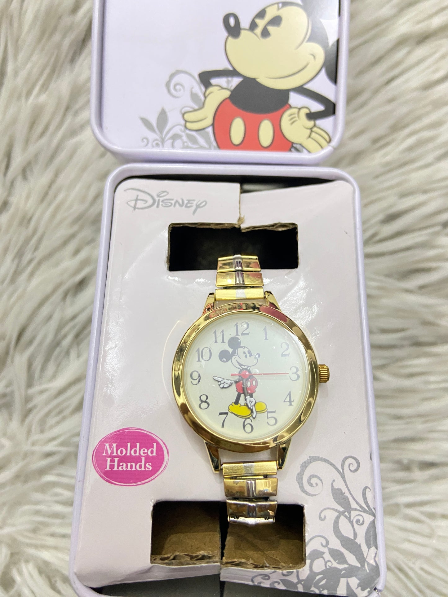 Reloj Disney original con Mikey mouse de fondo en dorado.
