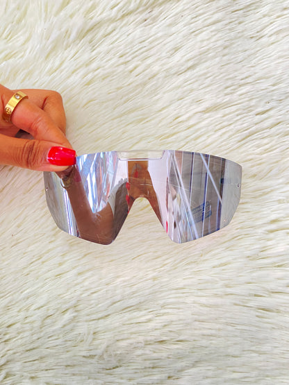 Lentes, plateados grandes con montura transparente, 100 % Polycarbonate y protección UV.