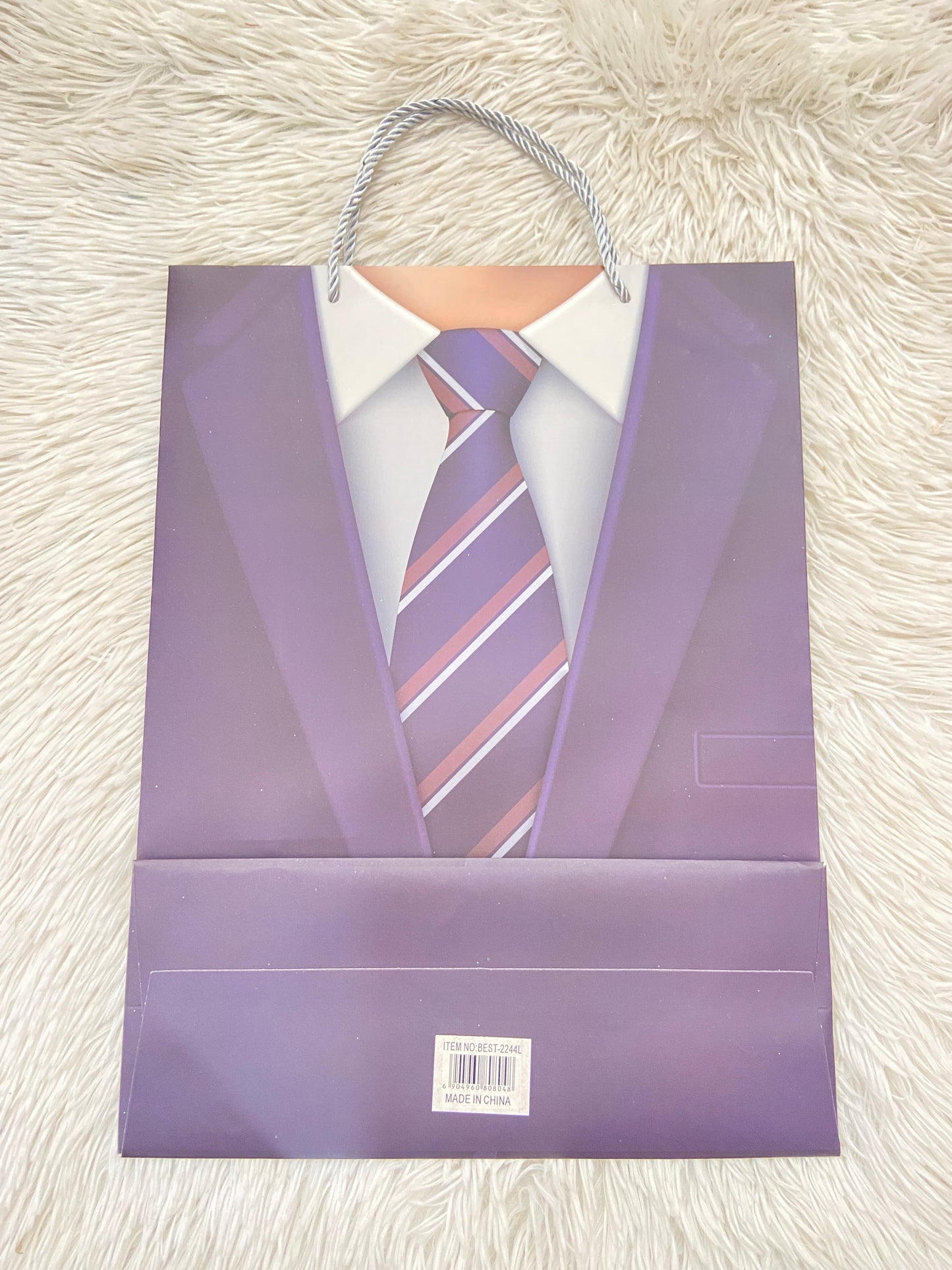 Shopping azul Marino con estampado de una corbata y brillos en los lados.
