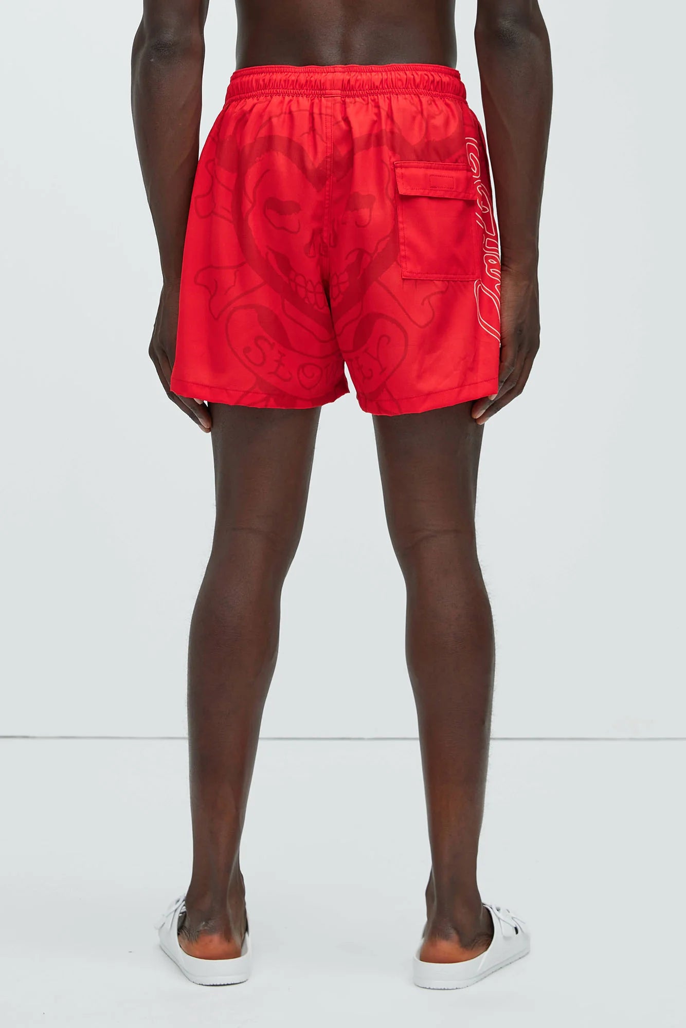 Bañador/Baggy, rojo con estampado de calavera y llamas.
