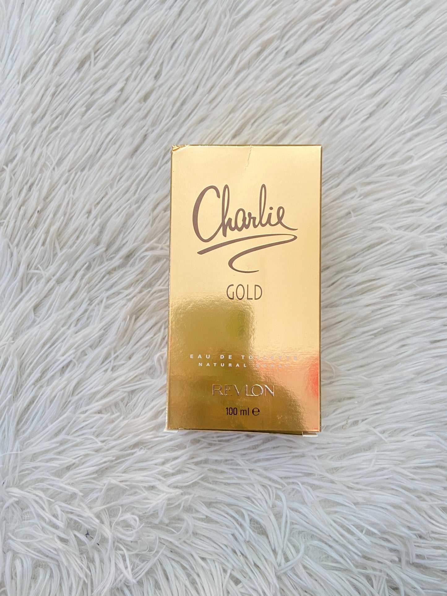 Perfume REVLON CHARLIE GOLD original naranja con detalles dorados.