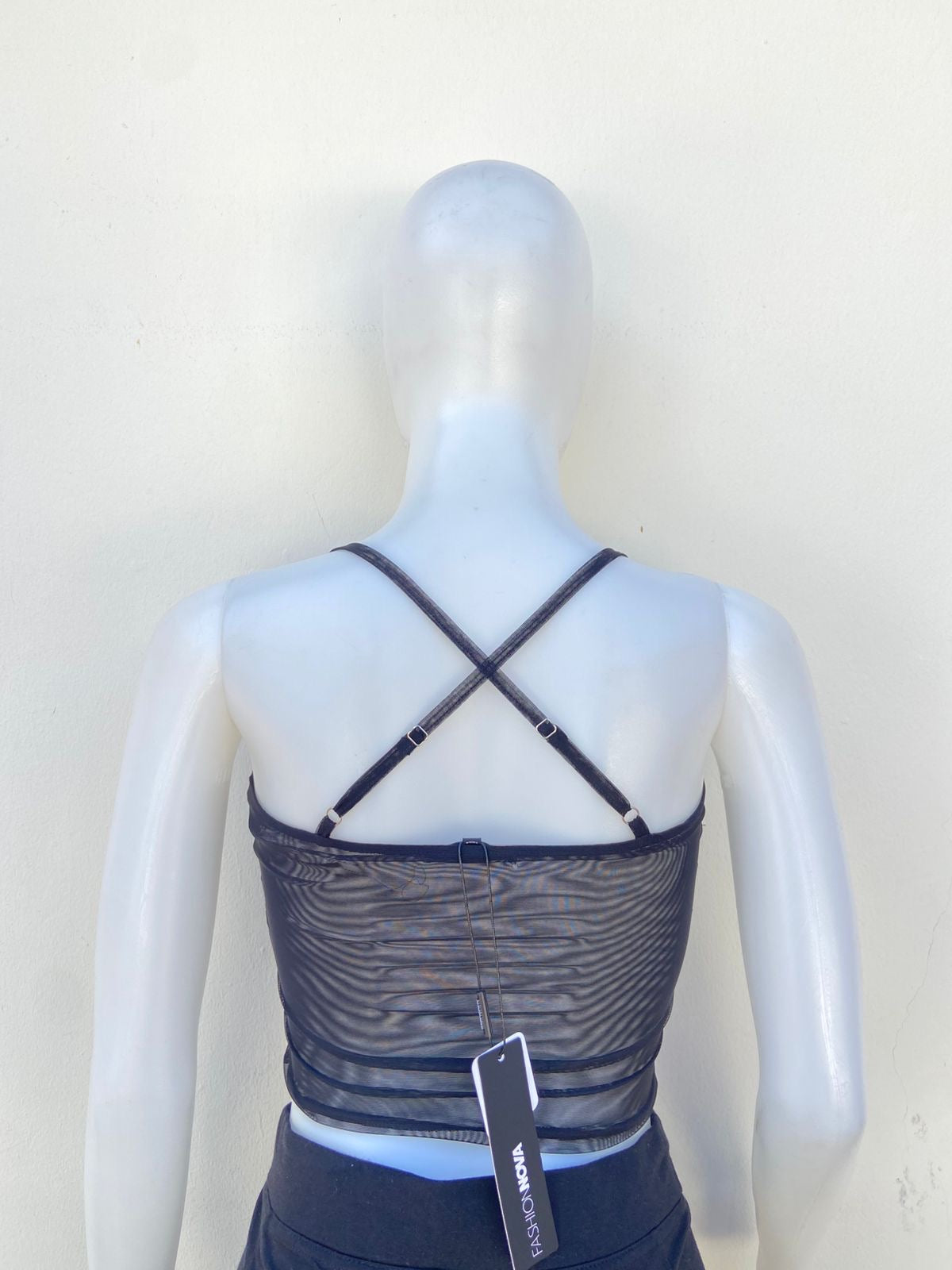 Top, negro con blanco estilo corset y lazos ajustables.