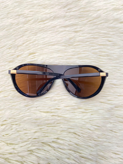 Lentes, marrones con micas en color  marrón claro, ovalados grandes.