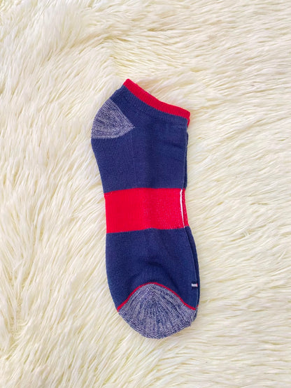 Medias TOMMY HILFIGER original, azul marino con la bandera de la marca en frente.