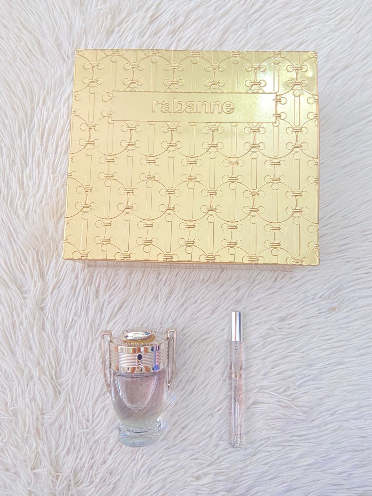 Set de dos INVICTUS Paco Rabanne Original perfume y mini perfume en color plateado.