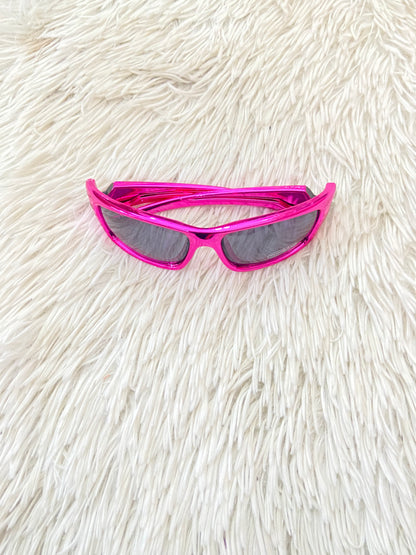 Lentes diseñados con protección UV 100-400 para proteger tu visión. Rosado metálico, micas oscuras.