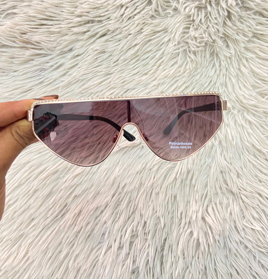 Lentes, negro con micas claras y detalles de brillos en la parte de arriba.