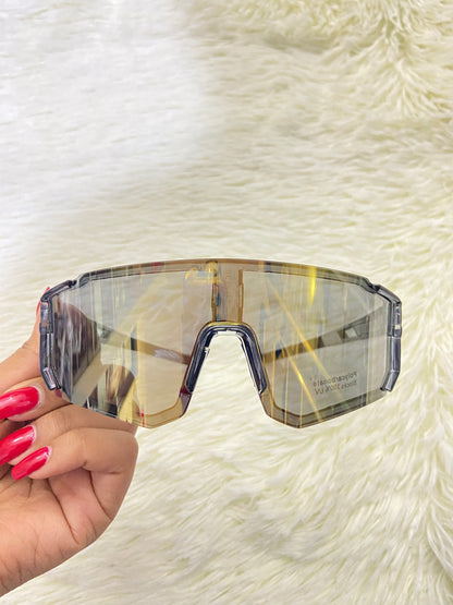 Lentes, gris con micas que cambian de color a dorado cromados, 100 % Polycarbonate más protección UV.