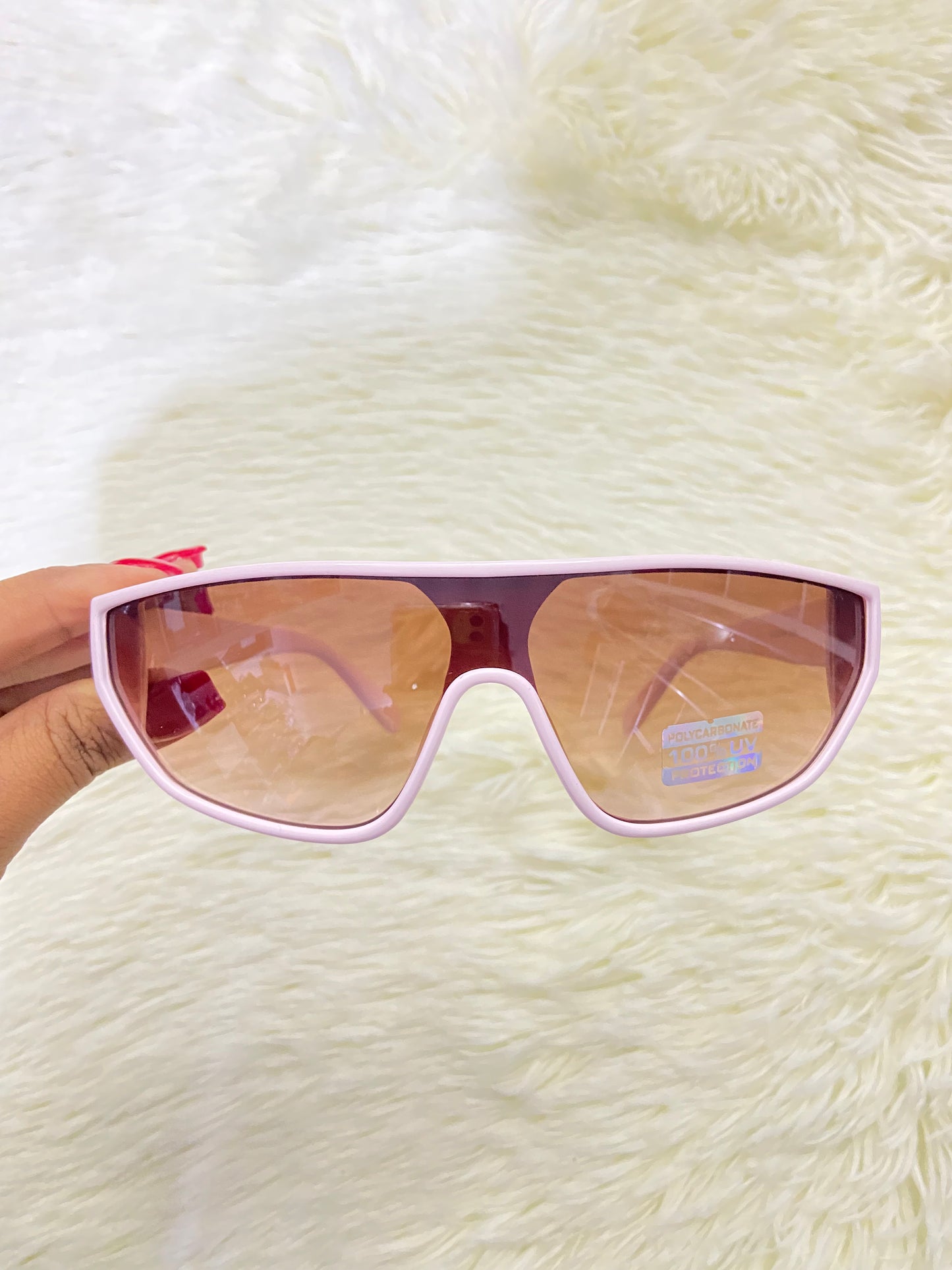 Lentes, rosado claros con micas en color marron y detalles en plateado, 100 % Polycarbonate y protección UV.