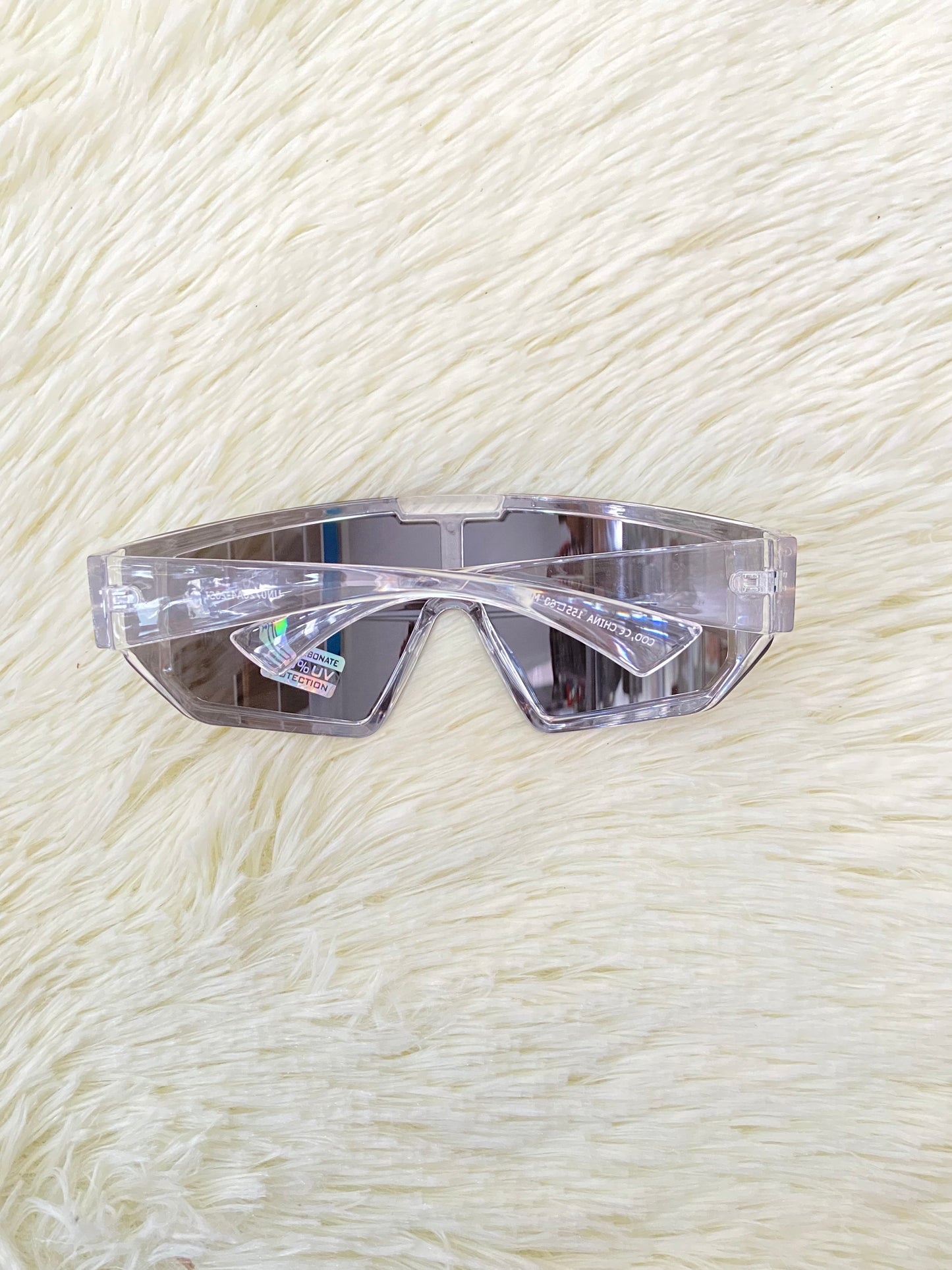 Lentes, plateados grandes con montura transparente, 100 % Polycarbonate y protección UV.