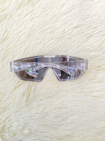 Lentes, plateados grandes con montura transparente, 100 % Polycarbonate y protección UV.