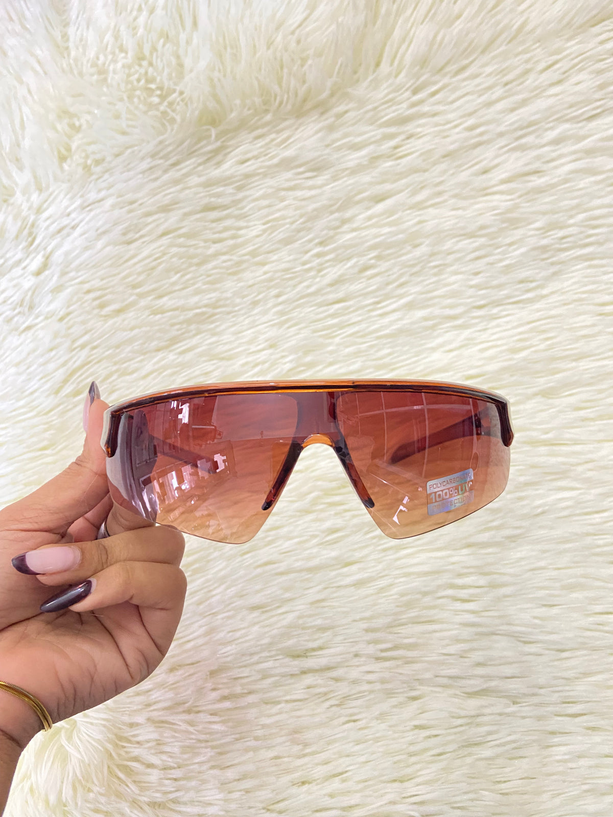 Lentes marrones, con micas claras + protección UV 100%.