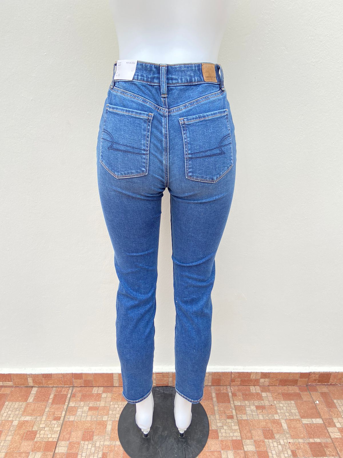 Pantalon jeans American Eagle original azul claro liso NEXT LEVEL STRETCH REGULAR HIGH RISE SKINNY
