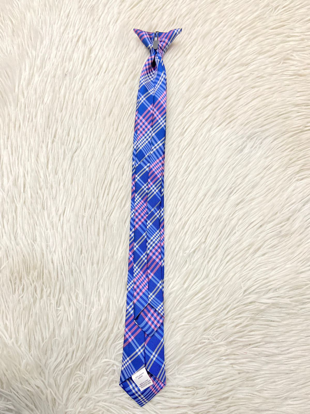 Corbata TOMMY HILFIGER original, azul marino con diseños en líneas, rosados y blancos.